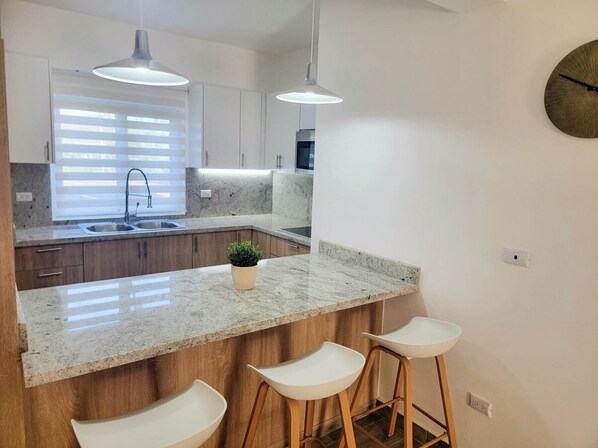 Fridge, microwave, stovetop, coffee/tea maker