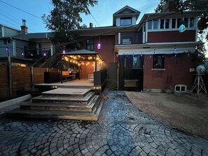 A residential property with a covered patio, outdoor seating, and a staircase leading to the entrance. - 4 BR, Luxurious-Gem/Mansion in Heart of Denver (Denver)