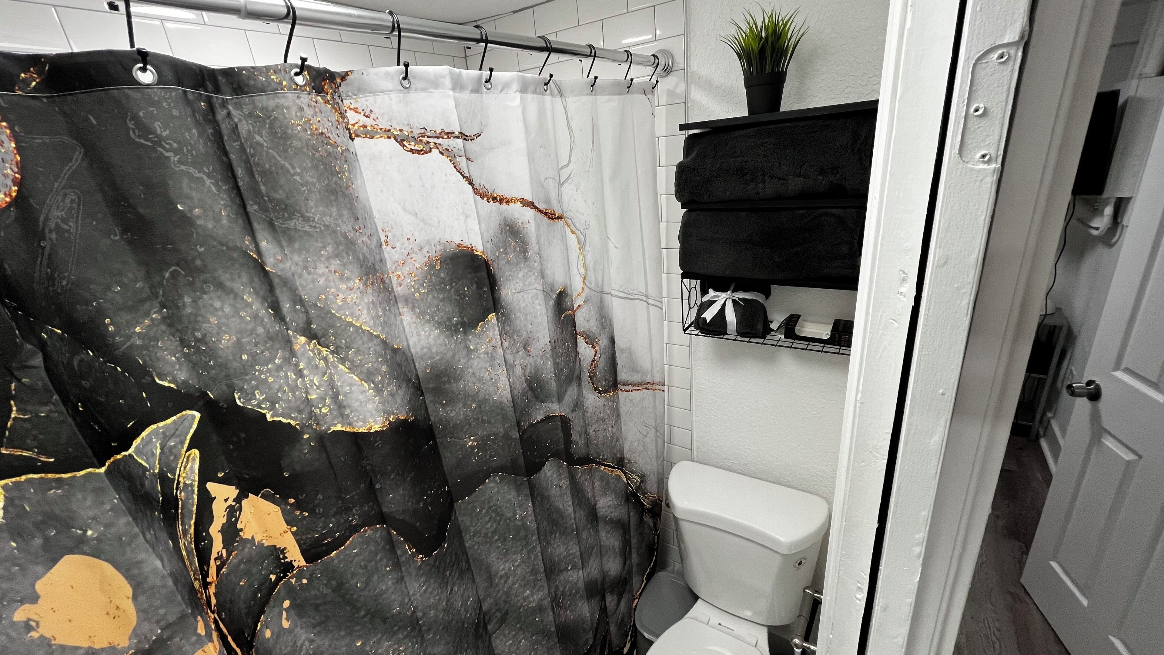 Shower, towels, soap, toilet paper