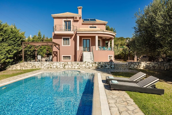 A two-story house with a swimming pool, stone walls, and a pergola. - Ilios Kefalonia With 3 Bedrooms and 3 Bathrooms (Kefalonia)