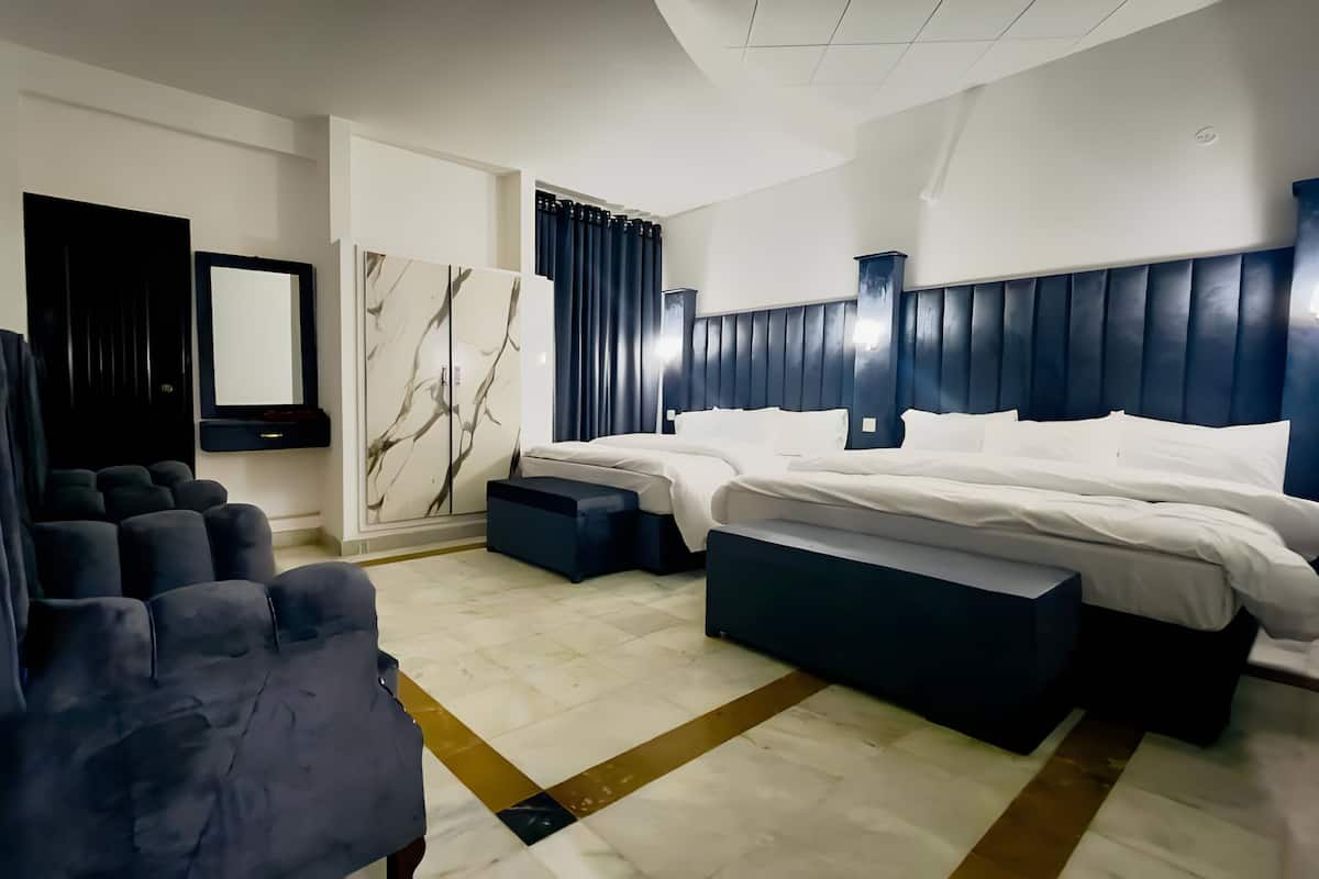 Deluxe Quadruple Room, City View | Desk, soundproofing, free WiFi