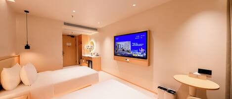 A modern hotel room with two beds, a TV, a desk, and a chair.