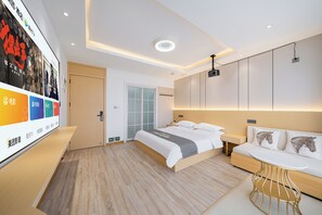 A modern hotel room with a bed, a sofa, a TV, and a desk. - Shanghai Lanting Resort Hotel (Shanghai Disneyland) (Shanghai)