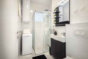 Shower, hair dryer, towels, soap