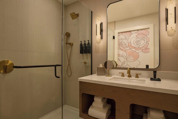 A modern bathroom with a walk-in shower, a vanity with a mirror, and a towel rack. - Canal House of Georgetown, a Tribute Portfolio Hotel (Washington)