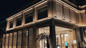 A hotel lobby with a grand entrance, large columns, and a decorative facade. - The Tivoli New Delhi (New Delhi)