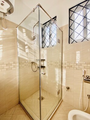 Shower, towels, soap, toilet paper