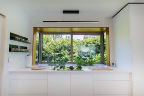 Fridge, microwave, oven, stovetop - The Bach | Luxury Waterfront Living with Spa Pool (Rotorua)