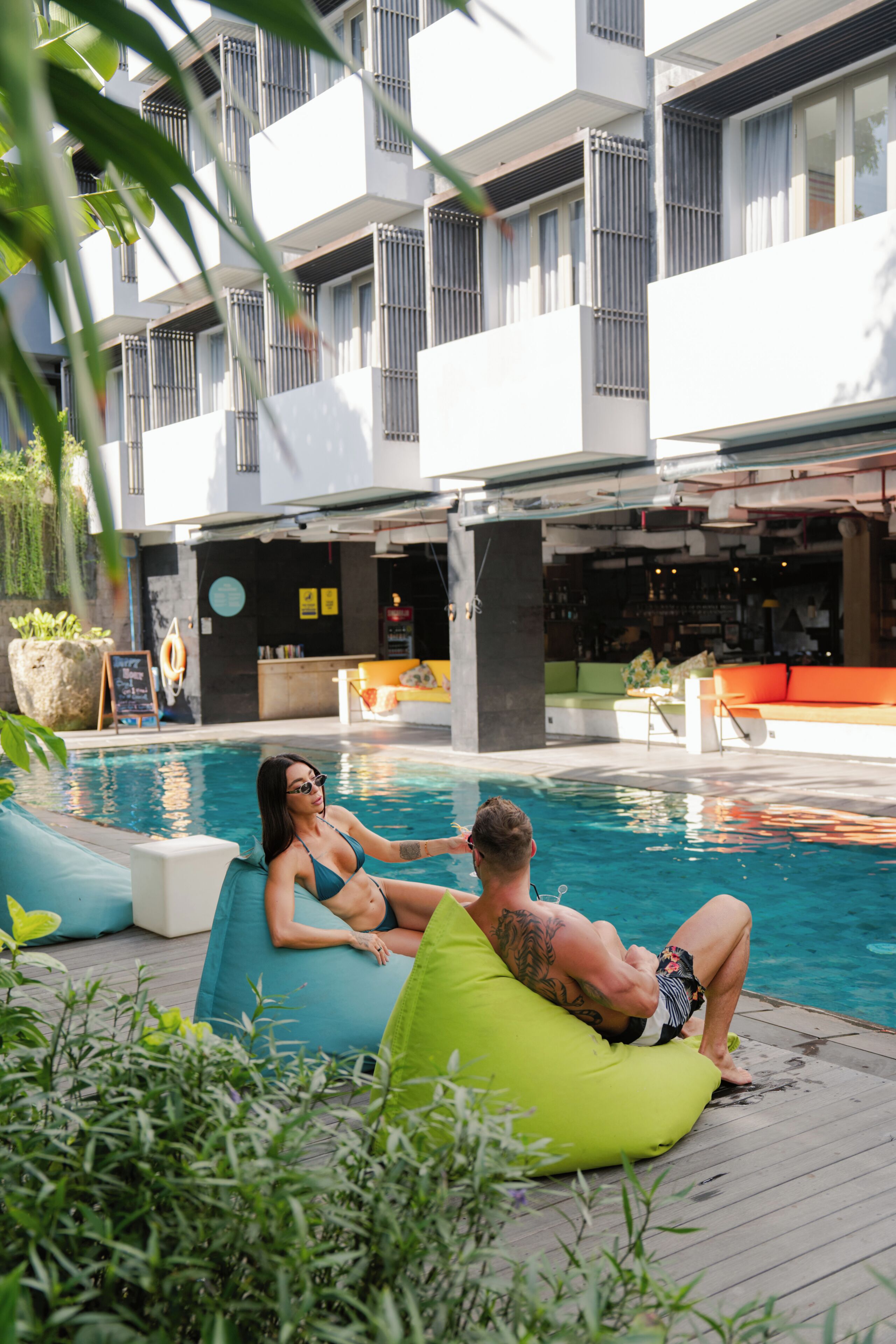 A pool area with loungers and a bar.