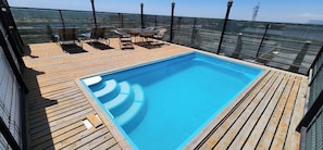 Seasonal outdoor pool, sun loungers