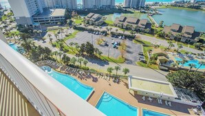 A resort with multiple buildings, a large swimming pool, and a marina.