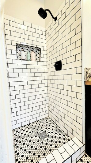 Shower, towels, soap, toilet paper