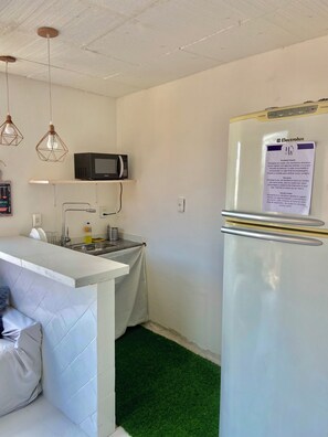 Fridge, microwave, blender, cookware/dishes/utensils