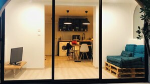 A modern interior with a kitchen, dining area, and a cozy seating space. - Carry le Rouet - Relaxation and vacations with your feet in the water  (Carry-le-Rouet)