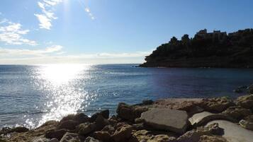 On the beach, sun loungers