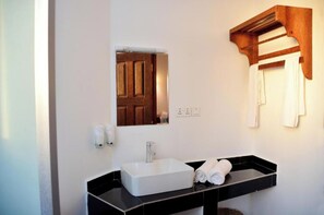Shower, hair dryer, towels, toilet paper