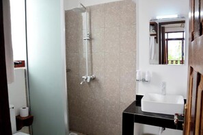 Shower, hair dryer, towels, toilet paper