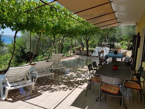 Outdoor dining - Vacation home Nella, directly by the sea (Maslenica)