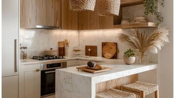 Deluxe Apartment | Private kitchen | Shared fridge, microwave, highchair