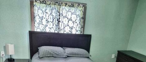 1 bedroom, desk, iron/ironing board, travel crib