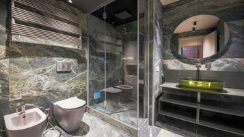 Executive Suite, City View | Bathroom | Designer toiletries, hair dryer, bathrobes, slippers
