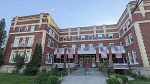 A large brick building with multiple windows and a central entrance. - The Historic Union Hotel (Union)
