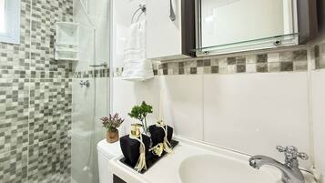 Shower, hair dryer, towels, soap