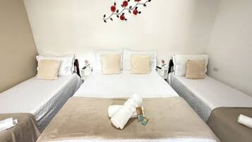 Hypo-allergenic bedding, blackout drapes, iron/ironing board, free WiFi