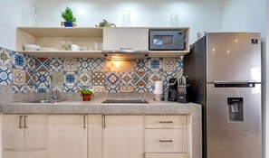 Fridge, microwave, stovetop, coffee/tea maker