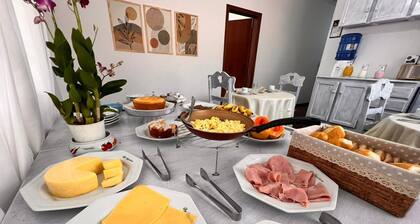 Dago Suítes Pousadinha