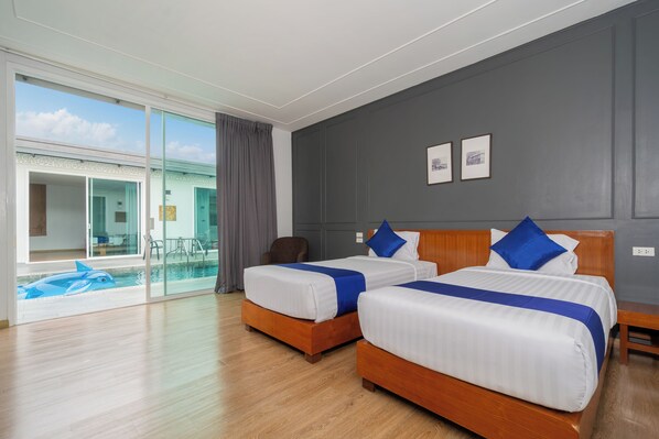 A hotel room with two beds, a large sliding glass door to a balcony, and a pool view. - Phuket La Siesta Pool Villa And Pool Access (Rawai)
