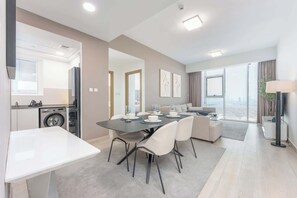 Enjoy a meal in the dining area with a table for four, or relax in the seating area with comfortable chairs.