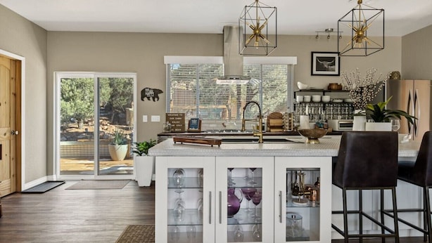 A modern kitchen with a central island, glass cabinets, and pendant lighting. - LUX Guest FAV + Stunning Views + Yoga Deck + Spa (Big Bear)