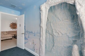 Experience a unique room with a textured wall feature and a cozy atmosphere.