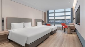 A modern hotel room with two beds, a desk, and a large window offering a city view. - Holiday Inn Express Yangzhou Grand Canal Theatre (Yangzhou)