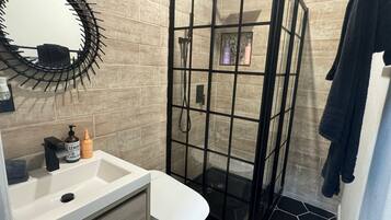 Shower, hair dryer, towels, soap