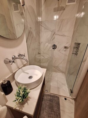Shower, towels, soap, shampoo