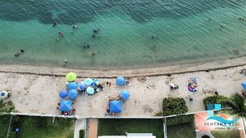 On the beach, sun loungers, beach towels