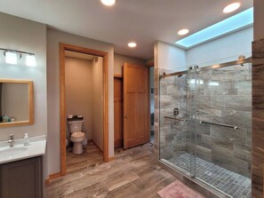 Shower, towels, soap, toilet paper