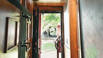 A wooden interior hallway with a sign that reads 'LIVE TO RIDE.'