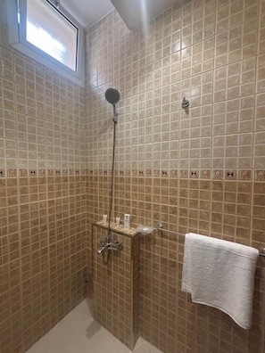 Bathtub, hair dryer, towels, soap