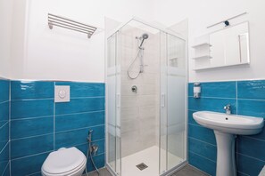 Superior Quadruple Room, Courtyard View | Bathroom | Shower, hair dryer, bathrobes, towels
