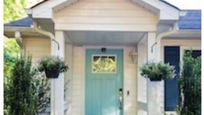 A house with a front porch, a blue door, and two potted plants on either side. - New! Lake, Dock, Pool Table, Firepit, Deck, Yard, Firepit (Henrico)