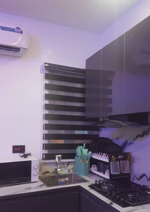Microwave, stovetop, coffee/tea maker, electric kettle