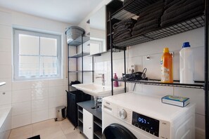 Shower, hair dryer, towels