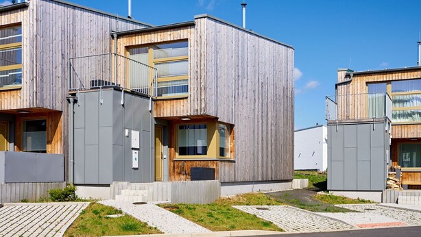A modern building with a wooden facade, multiple windows, and a flat roof. - Ore house by Interhome (Loucna pod Klínovcem)