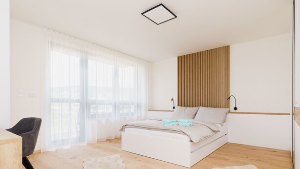 A modern bedroom with a large bed, a desk, and a view of the outdoors. - Bella Vista by Interhome (Loucna pod Klínovcem)