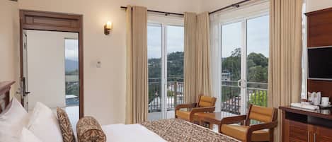 Deluxe Double Room, Balcony, Mountain View | In-room safe, desk, laptop workspace, blackout drapes