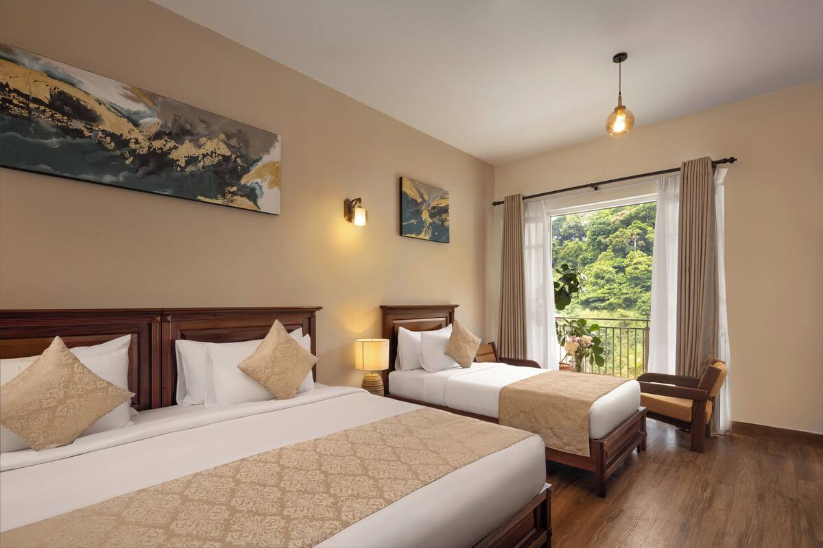Deluxe Triple Room, Balcony, Mountain View | In-room safe, desk, laptop workspace, blackout drapes
