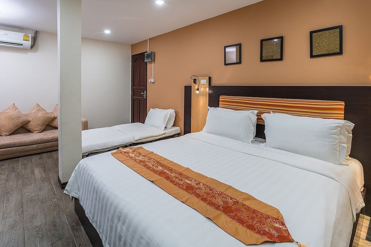 Deluxe Triple Room, Non Smoking, Private Bathroom | Memory foam beds, free minibar, in-room safe, desk